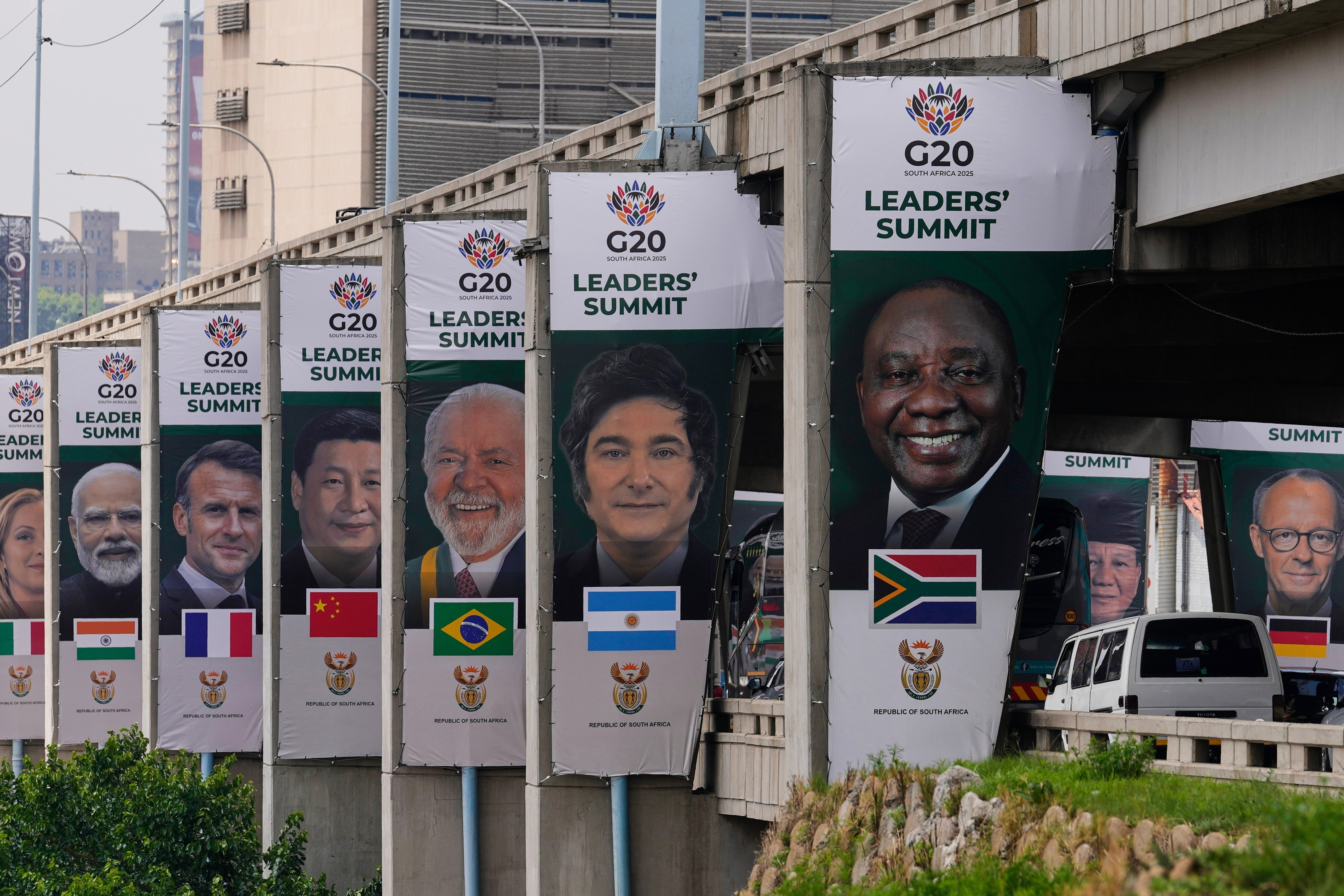 Banners of various G20 leaders are displayed along a Johannesburg freeway, in Johannesburg, South Africa, Thursday, Nov. 20, 2025.